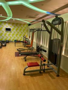 a gym with several tread machines in a room at Granada City’de modern lüx 1+1 in Alanya