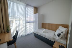 Postel nebo postele na pokoji v ubytování Hotel Smetanova + 37 fotografií