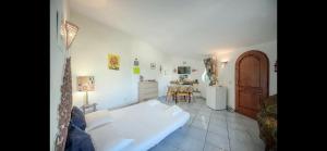 a living room with a white couch and a table at Villa Izzo in Ischia