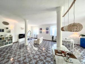 a living room with a couch and a table at Villa Izzo in Ischia