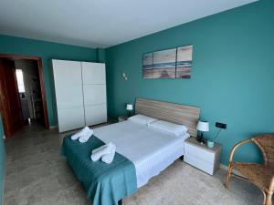 Postel nebo postele na pokoji v ubytování Golden Beach Sant Carles de La Ràpita