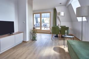 TV a/nebo společenská místnost v ubytování Aparthotel Bad Radkersburg
