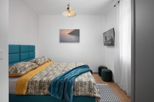 Säng eller sängar i ett rum på Cool Stay @Port