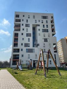 a large building with playground equipment in front of it at Apartament Kalina in Lublin