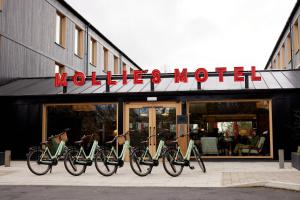 a group of bikes parked in front of a store at Mollie's Motel & Diner Bristol in Bristol