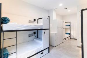 Łóżko lub łóżka w pokoju w obiekcie LOGUNE ROOMS