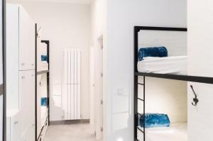 Łóżko lub łóżka w pokoju w obiekcie LOGUNE ROOMS