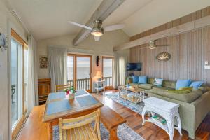 a living room with a couch and a table at Cape May Vacation Rental with Panoramic Ocean Views! in Cape May Court House