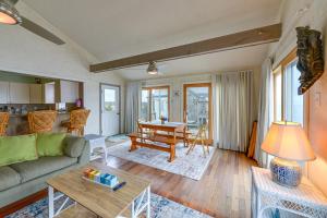 a living room with a couch and a table at Cape May Vacation Rental with Panoramic Ocean Views! in Cape May Court House