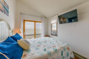 a bedroom with a bed and a tv on the wall at Cape May Vacation Rental with Panoramic Ocean Views! in Cape May Court House