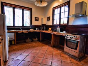 a kitchen with a counter and a stove top oven at Oak Tree Barn Bridgetown in Bridgetown