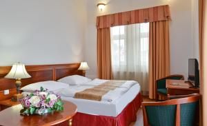 Postel nebo postele na pokoji v ubytování Hotel Continental