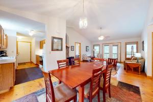 a dining room and living room with a table and chairs at Raven's Respite in Saluda