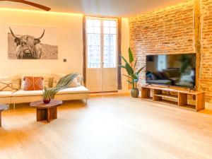TV a/nebo společenská místnost v ubytování Ribera AC by Staynnapartments