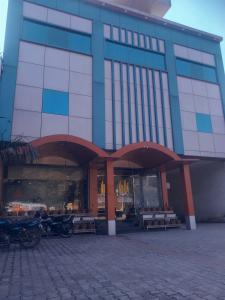 a building with benches in front of it at OYO Flagship Hotel Amarpali in Baddi