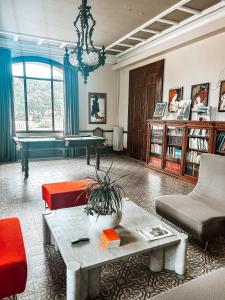 a living room with a couch and a table at B&B Château Valmy - Teritoria in Argelès-sur-Mer