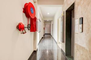 a red fire hydrant on the side of a hallway at Super OYO Flagship 79480 Flagship Hhh Skyline in Rānchī