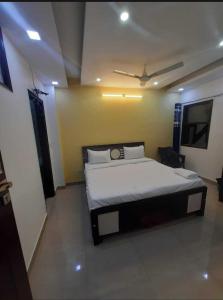 Cama o camas de una habitación en OYO Rajvanshi Hotel & Resort