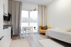Ένα ή περισσότερα κρεβάτια σε δωμάτιο στο Forenom Serviced Apartments Espoo Saunalahti