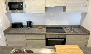 A kitchen or kitchenette at Moraira Holiday Apartment