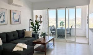 A seating area at Moraira Holiday Apartment