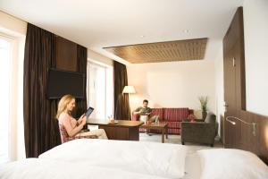 Una cama o camas en una habitación de Revital Resort Aspach