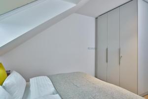 Giường trong phòng chung tại Lüttjeod Apartmentvilla Lüttjeod Apartmentvilla 15