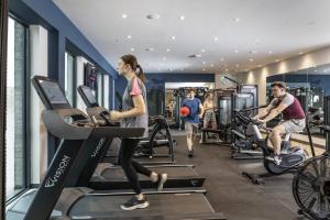 a group of people exercising on treadmills in a gym at For Students Only Ensuite Bedrooms with Shared Kitchen at Triumph House in Nottingham in Nottingham