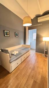 a living room with a large bed in a room at New Camp Nou Apartment/Diret Airport,Beautiful in Hospitalet de Llobregat