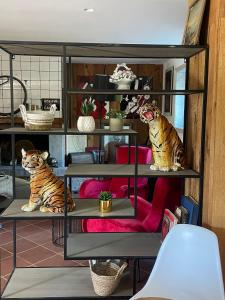 two tigers sitting on shelves in a room at VILLA DELLE ROSE CINQUE TERRE in Beverino