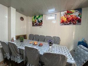 a conference room with a table and chairs and a table and chairsktop at ''NAVO'' Guest House in Bukhara