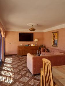 a living room with a couch and a flat screen tv at VILLA GIULIA & SOLEY 