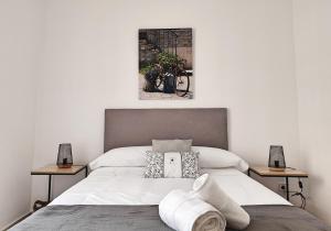 Postel nebo postele na pokoji v ubytování Céntrico Apartamento Jardines de Vallellano