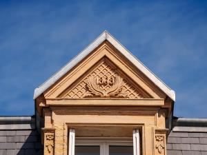 a building with an ornate window on top of it at La Cantellerie in Courseulles-sur-Mer
