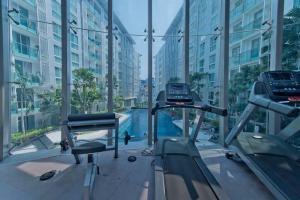 a gym with a swimming pool in a building at COOL VIEW Studio in CCR Condo in Pattaya Central