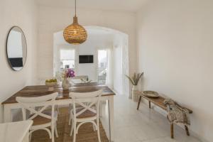 a dining room with a table and chairs at Piperi-2 Bedroom home in Naousa