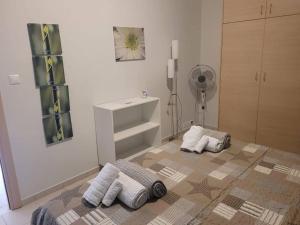 a bathroom with three pillows on the floor at One bedroom apartment with pool in Plakias