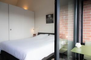 Postel nebo postele na pokoji v ubytování Designflats Gent
