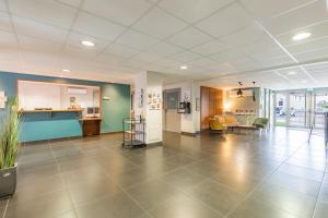 a lobby of a hospital with a waiting room at Appart'City Confort Agen Centre in Agen