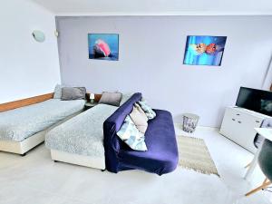 A bed or beds in a room at Studio Apartment with balcony 300m from beach