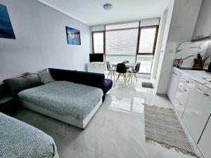 A kitchen or kitchenette at Studio Apartment with balcony 300m from beach