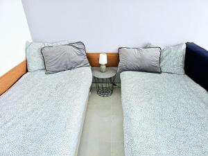 A bed or beds in a room at Studio Apartment with balcony 300m from beach