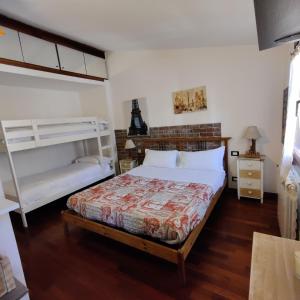 a bedroom with a bed and a bunk bed at Ca' Lucio MyTravelChioggia in Chioggia