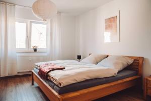 Postel nebo postele na pokoji v ubytování Haus am Zabelstein