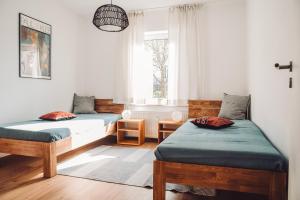 Postel nebo postele na pokoji v ubytování Haus am Zabelstein