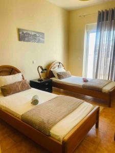 A bed or beds in a room at Home Sweet Home