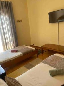 A bed or beds in a room at Home Sweet Home
