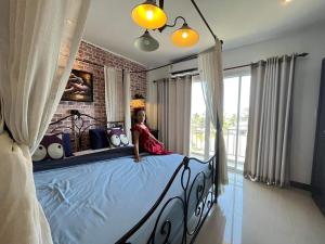 Postel nebo postele na pokoji v ubytování Mooz Huahin Bed & Breakfast