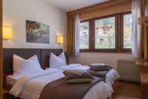 Postel nebo postele na pokoji v ubytování Hotel Arcobaleno + 37 fotografií