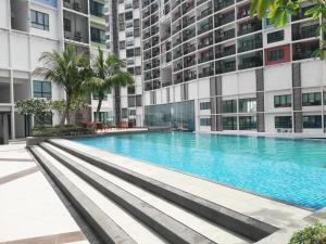 a swimming pool in the middle of a building at I-City Homestay @ Shah Alam in Shah Alam +11 photos